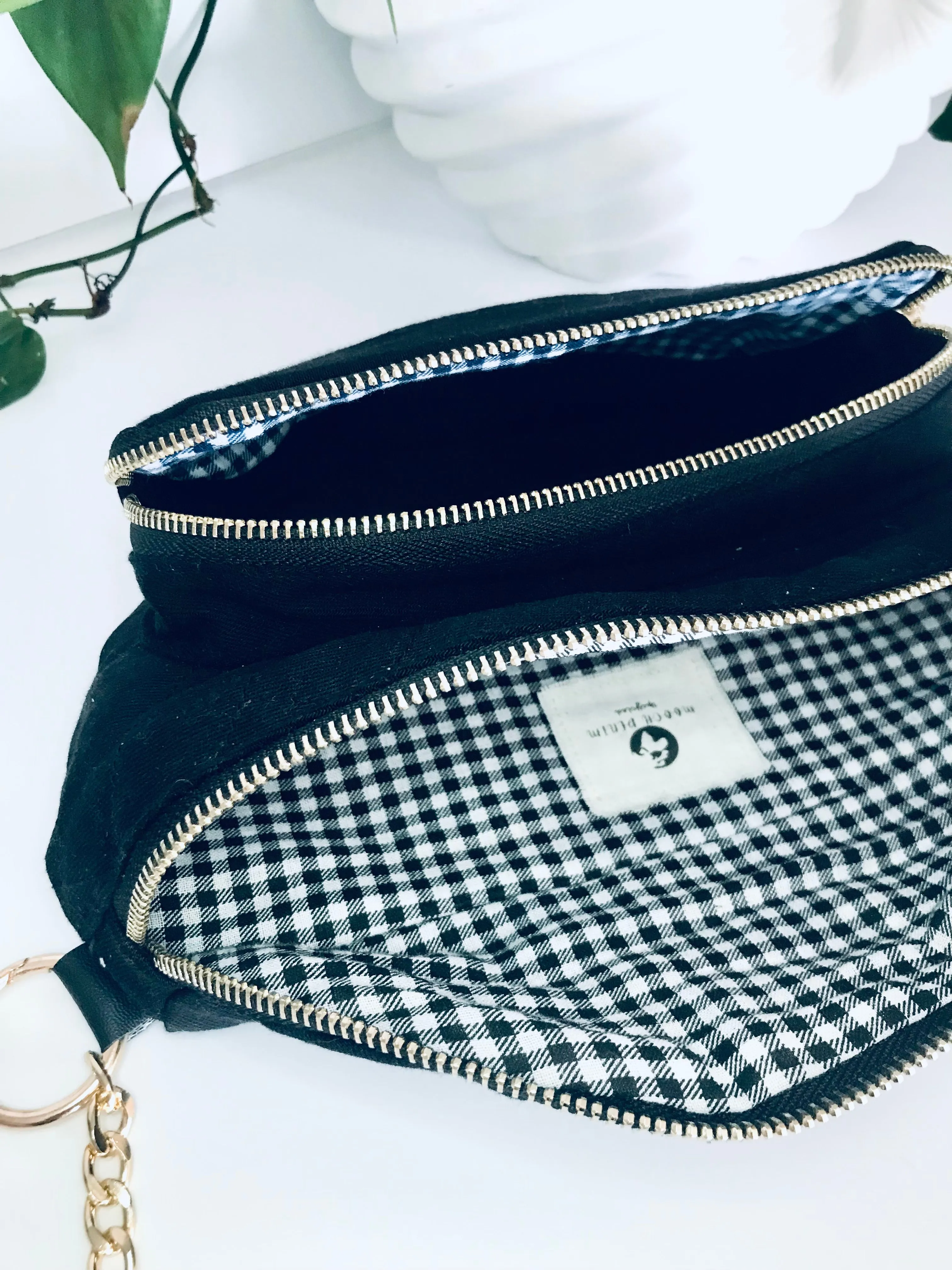 Black denim waist pack with gold chain detail